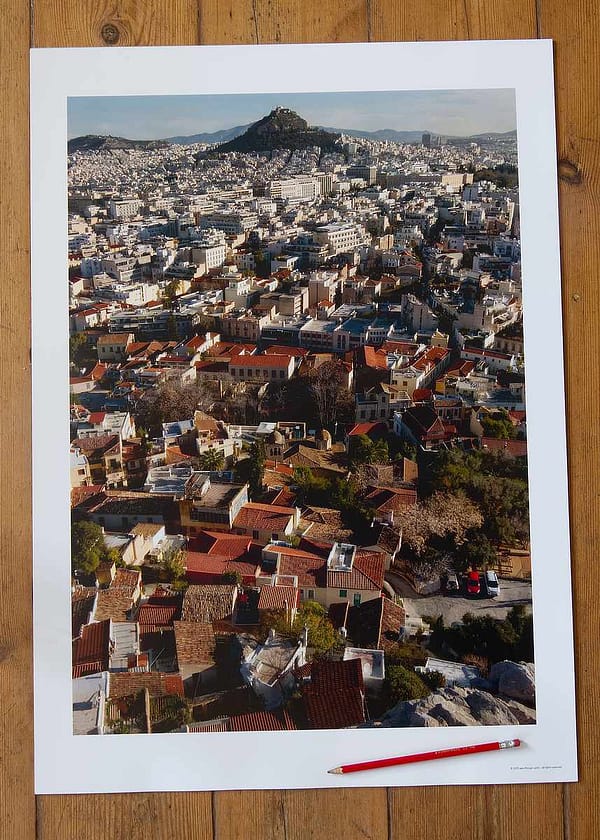 Artist-led photography print of Athens urban architecture in soft January morning light, featuring a cacophony of traditional pantile roofs and concrete structures on 250gsm heavyweight silken-touch media.